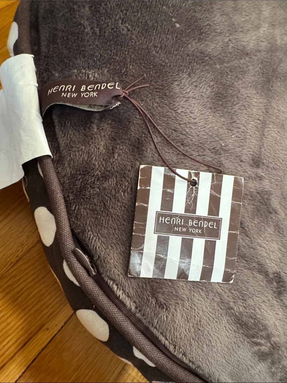 henri bendel Brown and White Polka Dot Round Dog Bed sleeping in stripes